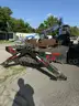 Heavy duty trailer with hydraulic arm