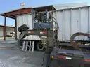 Heavy duty trailer with hydraulic arm