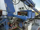 Heavy duty trailer with hydraulic arm