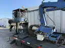 Heavy duty trailer with hydraulic arm