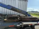 Heavy duty trailer with hydraulic arm