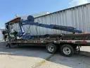 Heavy duty trailer with hydraulic arm