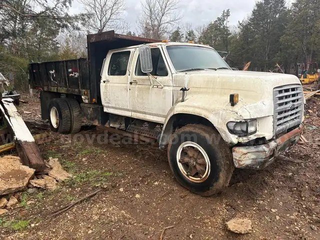 three 1996 ford f700 dump trucks