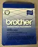 Brother ML 100 Standard typewriter with lid, various ribbons and corrective film ribbons, and cushioned pad (works!)