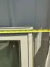 Two large windows with crank outs on each side and a screen for each side