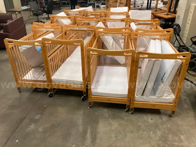 Lot of 16 Wood Cribs - all on wheels
