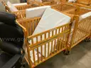 Lot of 16 Wood Cribs - all on wheels