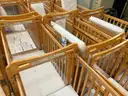 Lot of 16 Wood Cribs - all on wheels