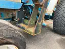 Ford 1720 Tractor with front bucket attachment