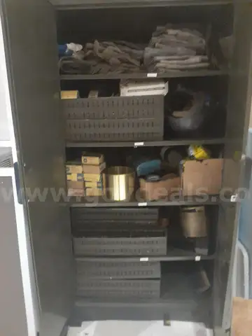 Cabinet full of miscellaneous welding supplies