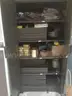 Cabinet full of miscellaneous welding supplies
