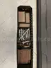 Cabinet full of miscellaneous welding supplies