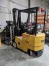 Electric forklift and charger - 1994 Yale ERC 030 3K-lbs. lift capability electric forklift and charger.