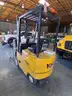 Electric forklift and charger - 1994 Yale ERC 030 3K-lbs. lift capability electric forklift and charger.