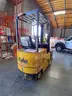 Electric forklift and charger - 1994 Yale ERC 030 3K-lbs. lift capability electric forklift and charger.