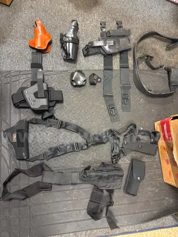 Miscellaneous lot of police weapons and accessories holsters