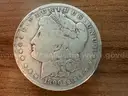 Lot of four Morgan Silver Dollars (1882, 1890 O, 1899 O, 1886 O)