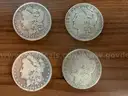 Lot of four Morgan Silver Dollars (1882, 1890 O, 1899 O, 1886 O)