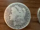 Lot of four Morgan Silver Dollars (1882, 1890 O, 1899 O, 1886 O)