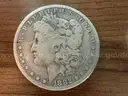 Lot of four Morgan Silver Dollars (1882, 1890 O, 1899 O, 1886 O)