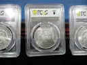 Lot of 4 Brilliant Morgan Dollars &#x2013; PCGS MS63 &#x2013; In Elegant Gift Box (Lot #11)