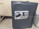 Lot 2. Sentry safe with keys, code, and book