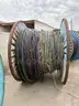 17 reels (12 steel + 5 wooden) of scrap spooled electrical distribution cable and 2 pallets and 1 crate of scrap (LOT 7)