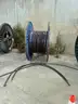 24 reels (13 steel + 11 wooden) of scrap spooled electrical distribution cable and 5 pallets scrap (LOT 8)