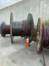 24 reels (13 steel + 11 wooden) of scrap spooled electrical distribution cable and 5 pallets scrap (LOT 8)