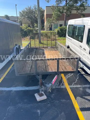 One (1) Black Flat-Bed Trailer