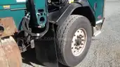 2016 Peterbilt 320 with 28YD Heil half pack