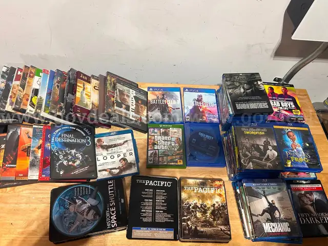 Mixed media lot including approximately +85 DVDs and Blu-ray movies, plus 4 video games for PlayStation 4 and Xbox One.