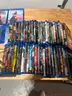 Mixed media lot including approximately +85 DVDs and Blu-ray movies, plus 4 video games for PlayStation 4 and Xbox One.