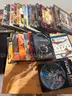 Mixed media lot including approximately +85 DVDs and Blu-ray movies, plus 4 video games for PlayStation 4 and Xbox One.