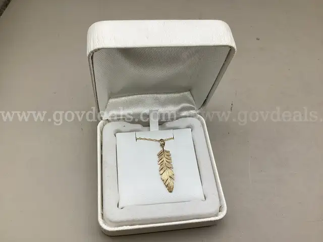 14K 18&#x201D; Feather Necklace ( Retail Tag Price $700.00 )