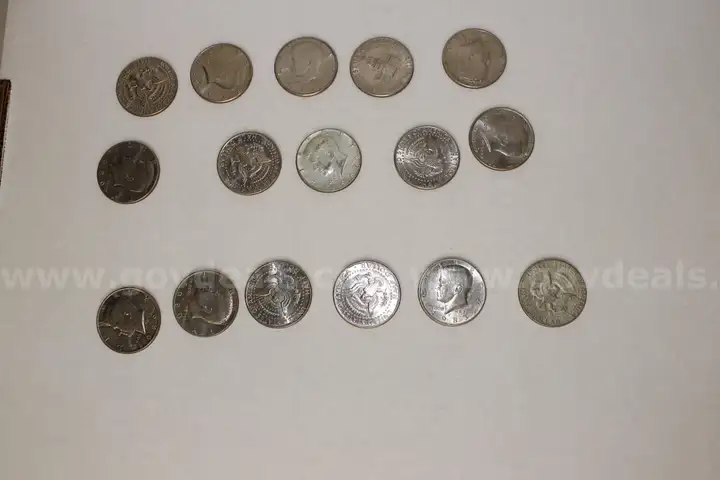 One lot of 16 Half Dollars and one $2 Bill