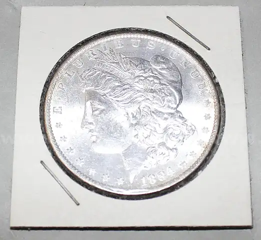 Uncirculated 1884 Morgan Dollars, 10k Gold Ring, and Various Necklaces