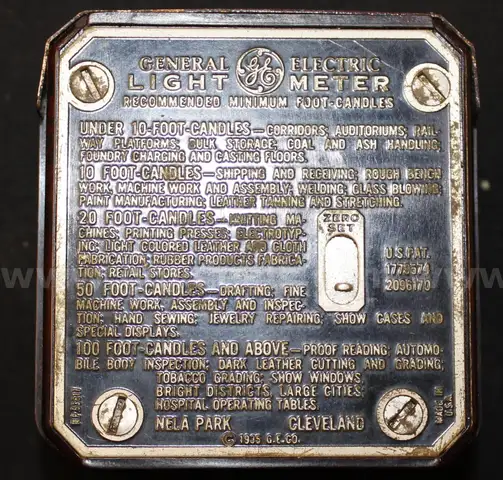 Vintage GE Light Meter and Various Currency