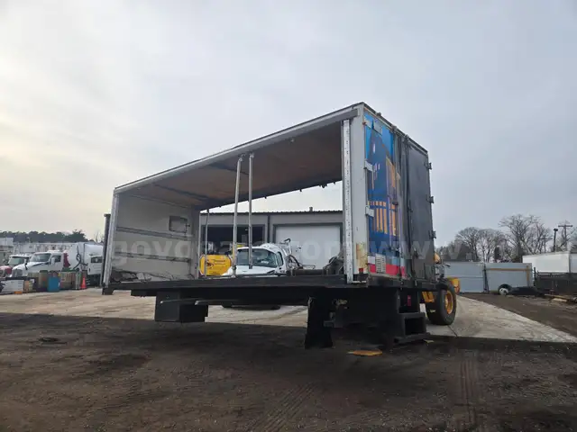 24' flatbed with Moffett forklift rack