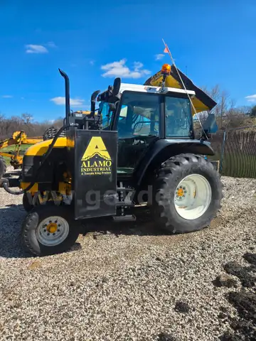 New Holland TS 100 Tractor with an Alamo Mower