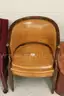 Antique wooden/leather/leatherette chairs used at US Mint.