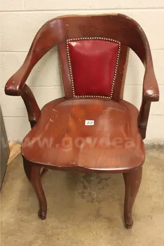 Antique wooden/leather/leatherette chairs used at US Mint.