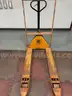 Manual pallet jack with guarding