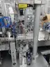 MiQ Machines with Fluidic Processing Machine and Cartridge Pouching Labeling Machine with BeiJer X2pro System Controller