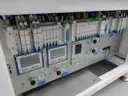 MiQ Machines with Fluidic Processing Machine and Cartridge Pouching Labeling Machine with BeiJer X2pro System Controller