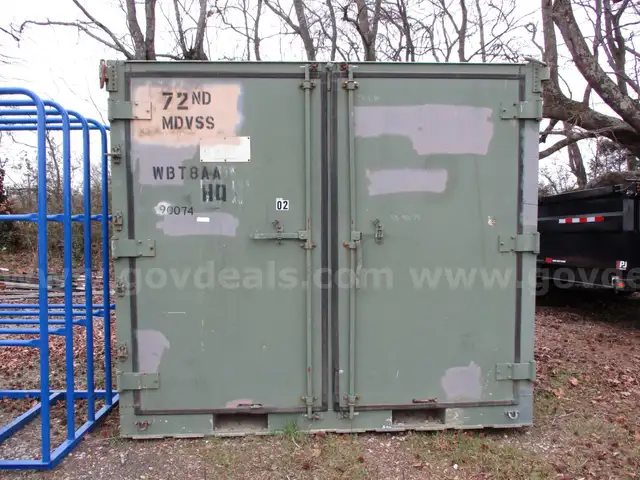 Green Conex box with split middle