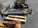 Misc. used spare parts: cylinders for CAT 350, lift axle for Mack, screens,  Volvo A40 hood, Cutter D6R, Couplers