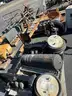 Misc. used spare parts: cylinders for CAT 350, lift axle for Mack, screens,  Volvo A40 hood, Cutter D6R, Couplers