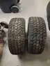 two studded snow tires with rims  Mastercraft Glacier Grip II 235/55R17