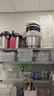 Commercial Chrome Wire Shelving Racks with Assorted Kitchen Supplies